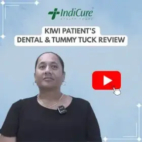 A headshot of a woman named Lua sharing her review of dental work and a tummy tuck with IndiCure.